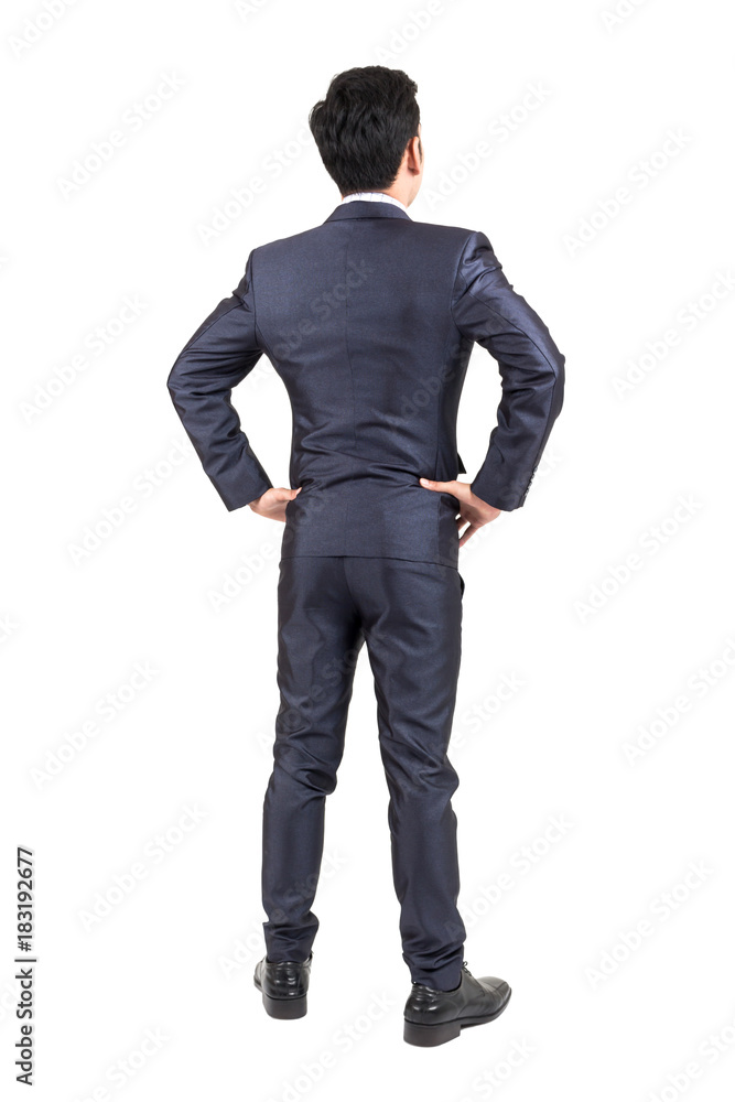 Businessman in black suit standing isolated on white background Businessman in black suit standing isolated on white background