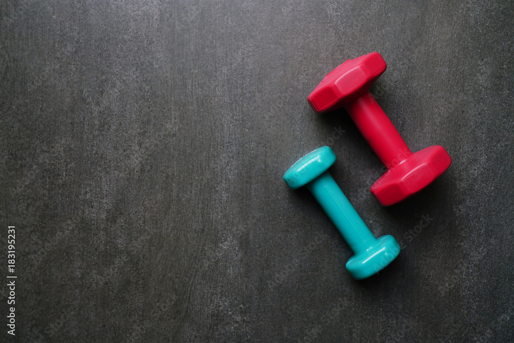 dumbbells on the black table, fitness healthy and sport concept dumbbells on the black table, fitness healthy and sport concept