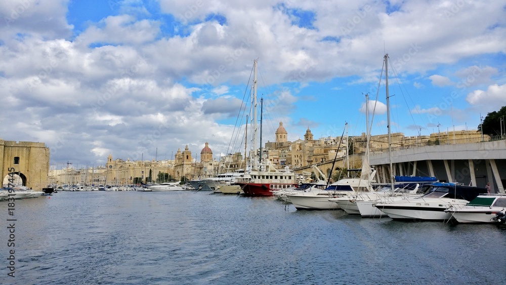 Modern Boats in front of the historical part of Malta