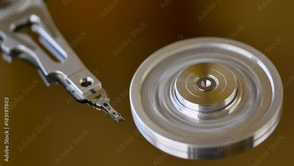 Inside of HDD with readwrite head moving on platter. 4K