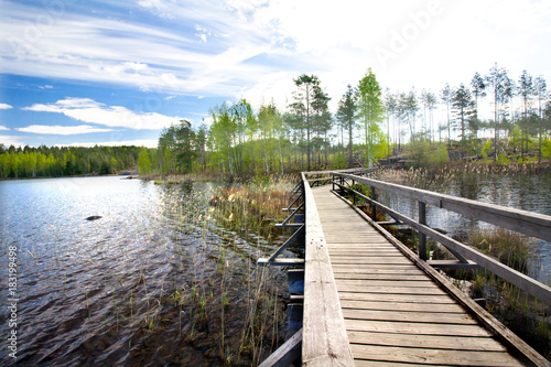 Wooden pier on beautiful lake in the national park Repovesi, Finland, South Karelia. © Elena Noeva