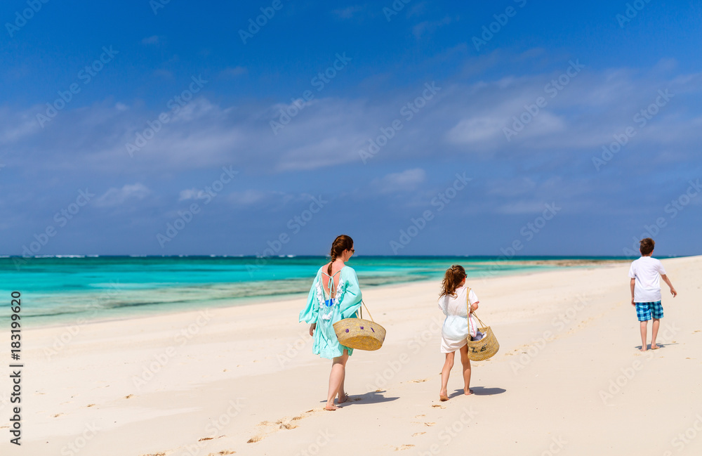 Mother and kids at tropical beach