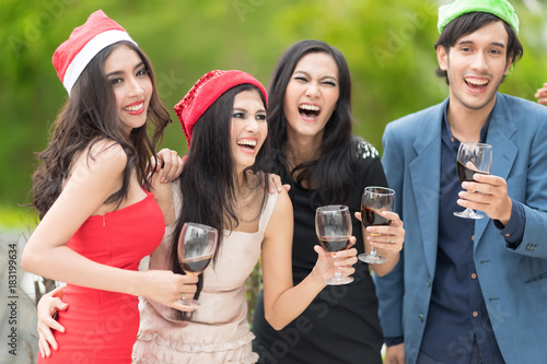 Red wine Christmas party concept. Happy new year coming soon.People celebrating happy drinks with friends