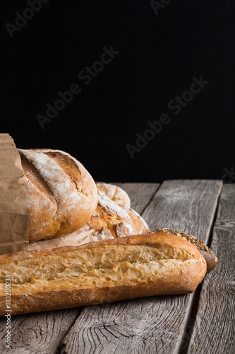 Bread background with copy space on rustic wood