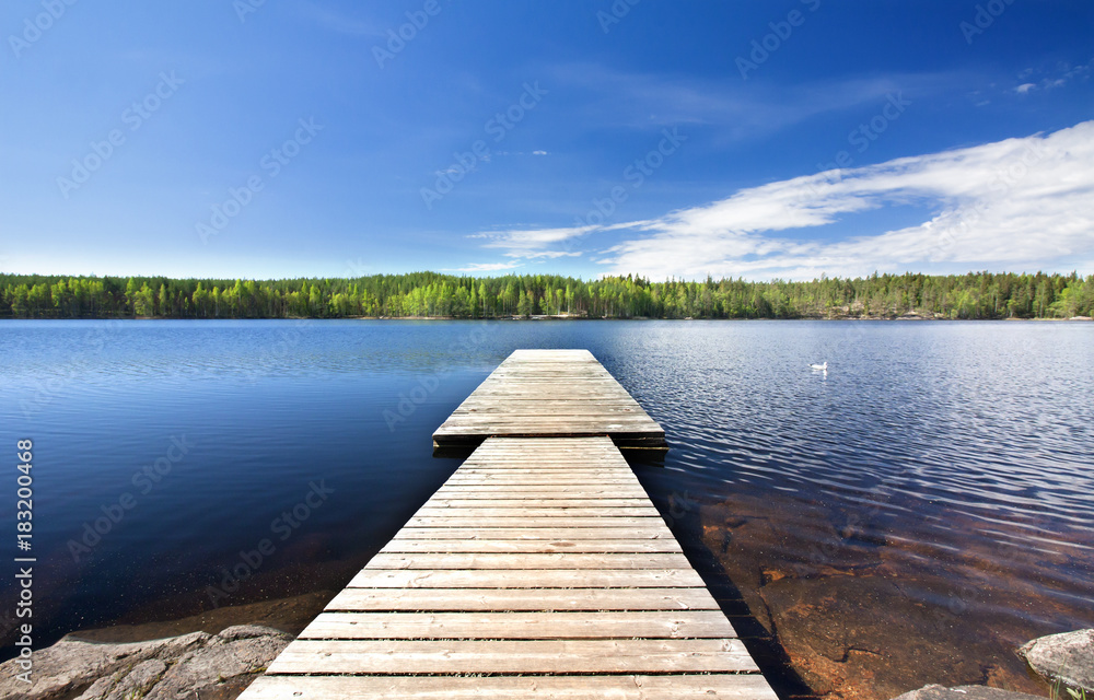 Wooden pier on beautiful lake in the national park Repovesi, Finland, South Karelia. Wooden pier on beautiful lake in the national park Repovesi, Finland, South Karelia.