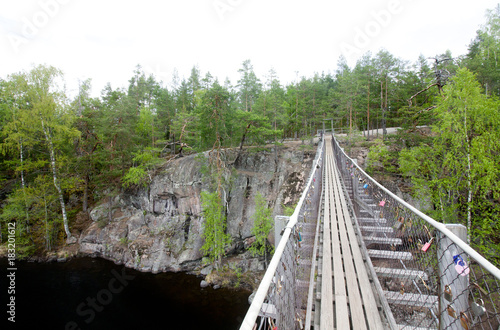 Rope bridge in the National Park Repovesi, Finland. photo