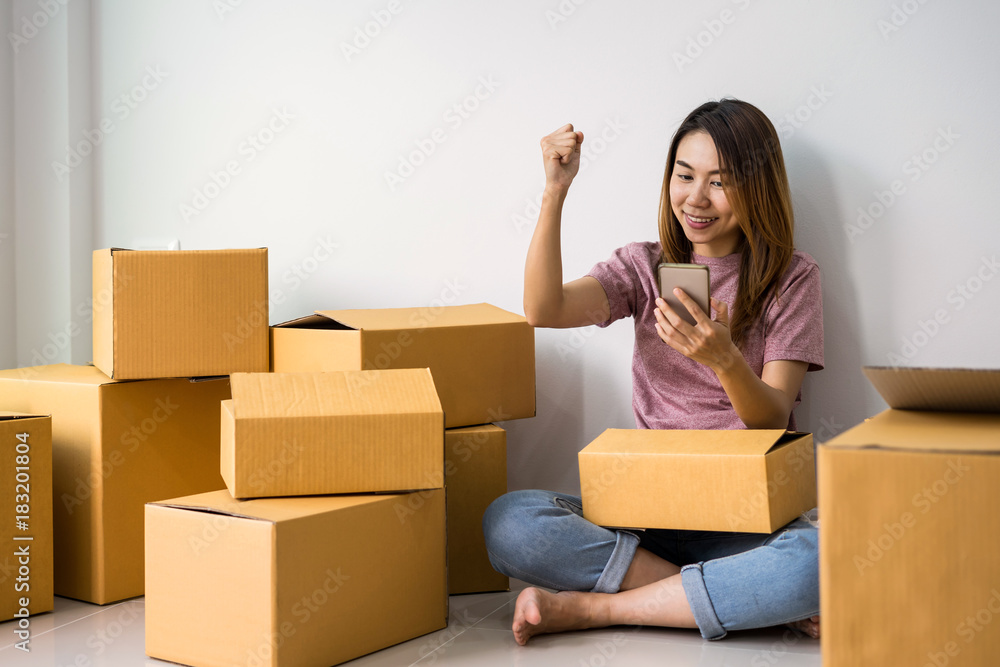 Young woman working online business by using smart phone Young woman working online business by using smart phone