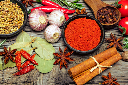 Fototapeta Naklejka Na Ścianę i Meble -  Spices and herbs on wooden background