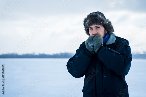 Bearded hipster man in winter clothers outdoor