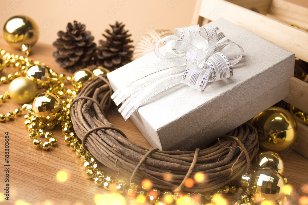 gift box with gold christmas decor and bokeh gift box with gold christmas decor and bokeh