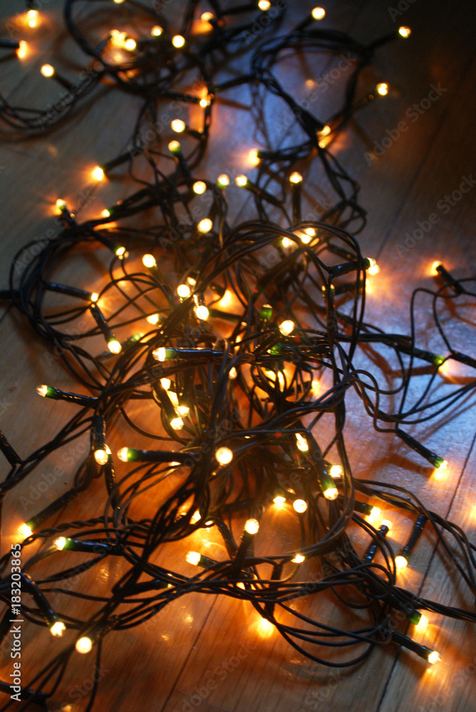 Fototapeta premium Christmas lights isolated on the floor.