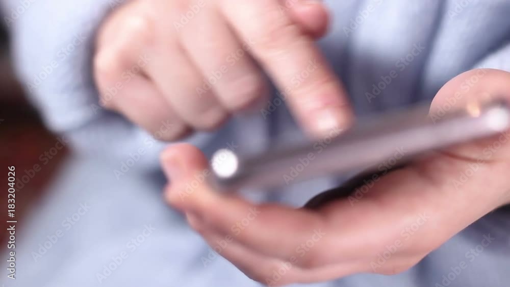 A woman uses a smartphone. Close up. A woman uses a smartphone. Close up.