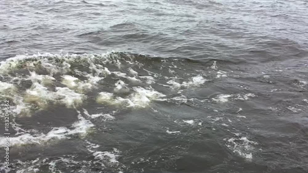the dispersing river waves from the boat the dispersing river waves from the boat