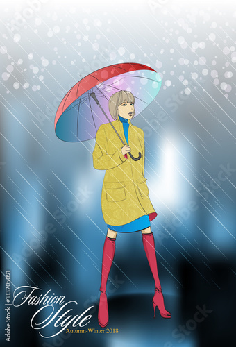 Autumn-winter 2018. Beautiful girl in a coat with an umbrella, against the background of a rain with snow. Autumn fashion model.