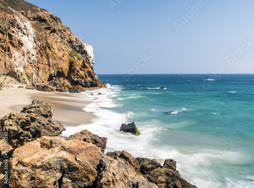 Dume Cove Malibu, Zuma Beach, emerald and blue water in a quite paradise beach surrounded by cliffs. Dume Cove, Malibu, California, CA, USA photo