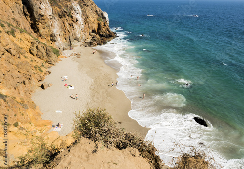 Dume Cove Malibu, Zuma Beach, emerald and blue water in a quite paradise beach surrounded by cliffs. Dume Cove, Malibu, California, CA, USA photo