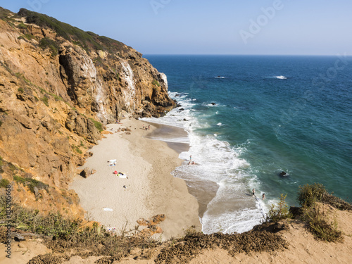 Dume Cove Malibu, Zuma Beach, emerald and blue water in a quite paradise beach surrounded by cliffs. Dume Cove, Malibu, California, CA, USA photo