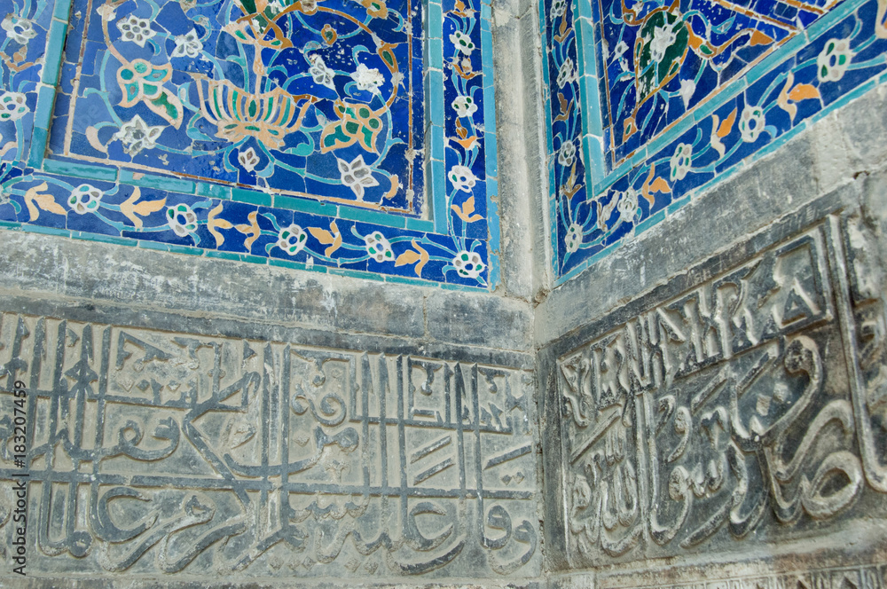 Fragment of wall decoration mosaic in traditional Asian style. the details of the architecture of medieval Central Asia