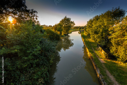 Grand Union canal in the summer evening sunlight  photo