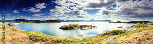 Scenic panorama of a rock in fjord water. Norway