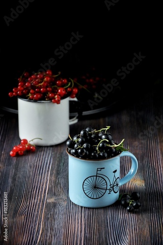 Mug of berries, jar of berries, currant
