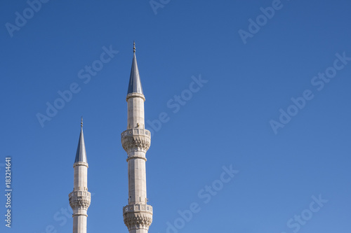 Fototapeta Mosque Minarets and Clean Blue Sky
