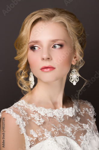 portrait of a bride happy girl in a make-up hairstyle