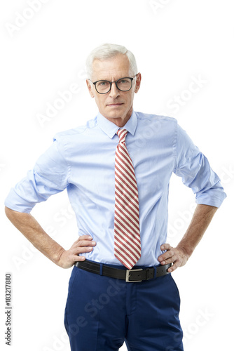 Portrait of a senior businessman standing on white background