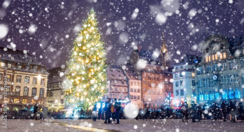 Christmas market under the snow in Strasbourg, Alsace, France