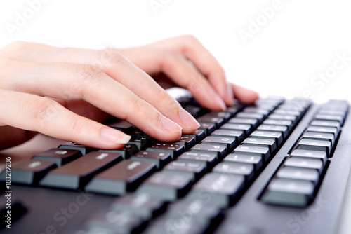 Hands typing on the keyboard