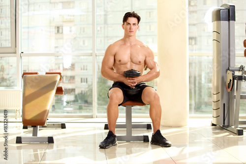Muscular young man training...