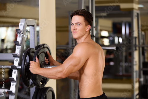 Muscular young man training...
