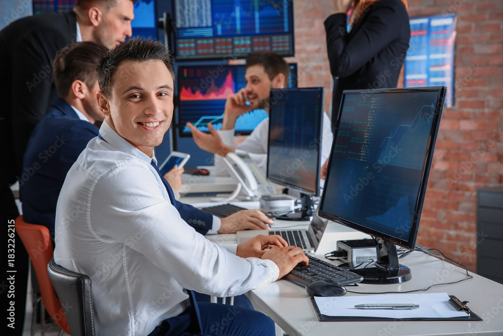 Stock traders working in office Stock traders working in office