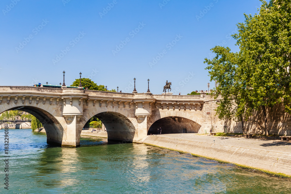  Island of the City. Quai des Orfevres. New bridge in Paris over the river Sena (Pont Neuf). Equestrian statue of Henri IV. Paris, France