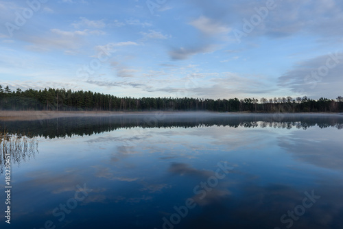 lake with water reflections in colorful autumn day