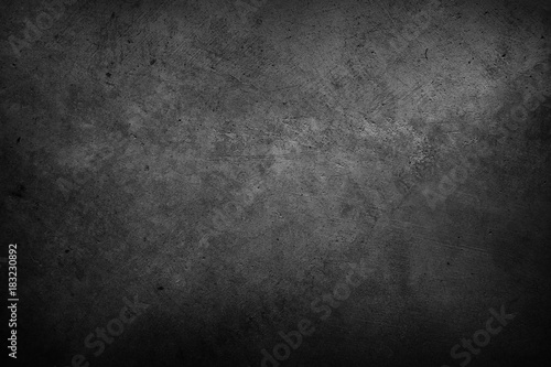 Dark grungy black textured concrete wall background