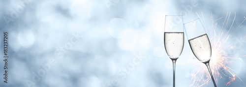 Abstract winter background with champagne and sparkler