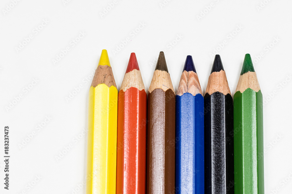 Cute baby pencil crayons on a white table. Isolated background. Cute baby pencil crayons on a white table. Isolated background.