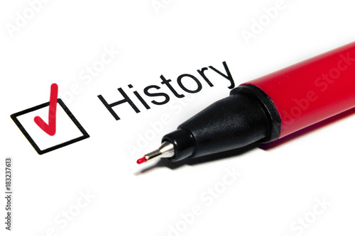 Questionnaire: check mark on the word "HISTORY" and red pen. Closeup, concept