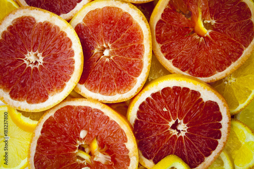 Grapefruit slices background texture.