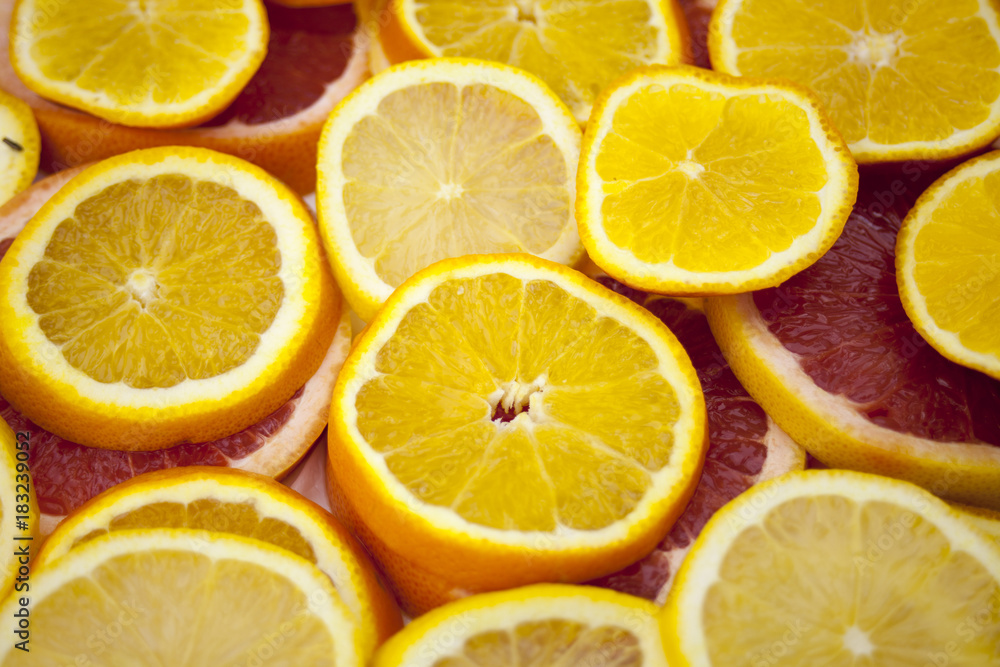 Orange grapefruit slices background texture.