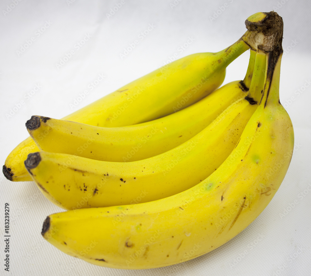 A bunch of  four banana, bananas isolated on white background