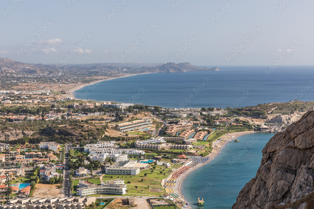 Fototapeta premium Stony landscape of Tsambika mountain and a view of Kolymbia, a small resort on the Rhodes Island, Greece. 