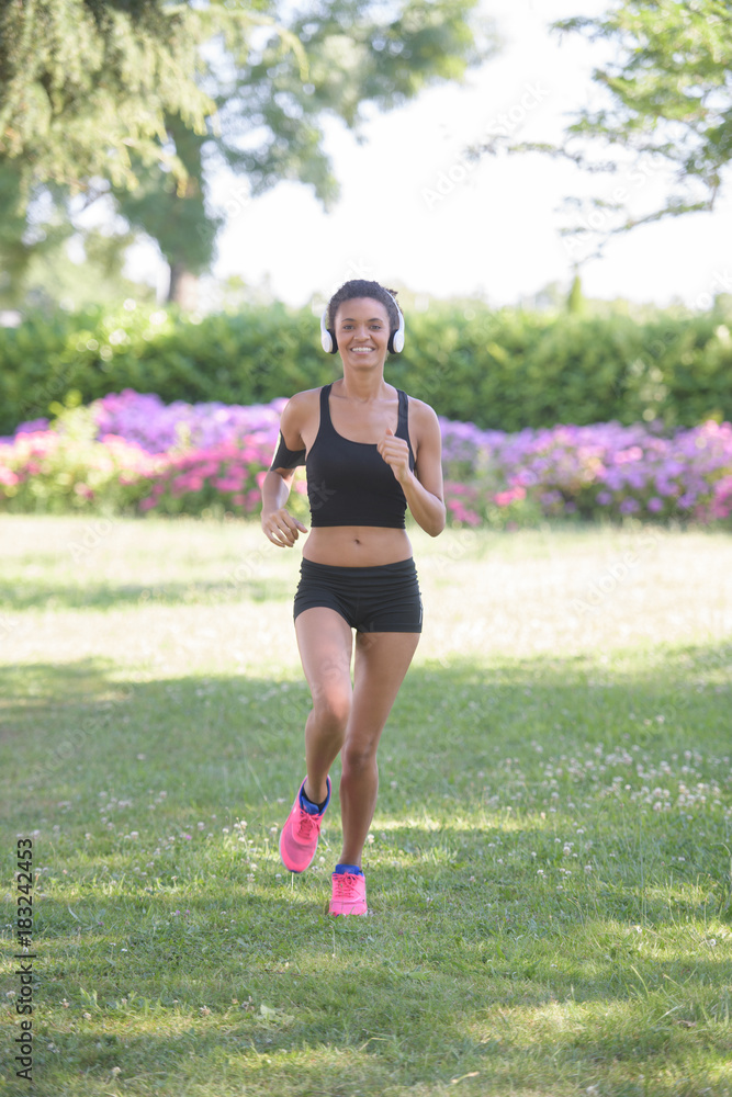 young fitness sports woman runner running on park trail young fitness sports woman runner running on park trail