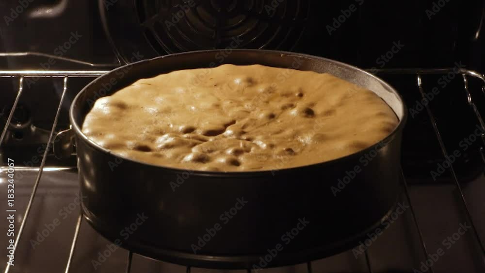 cake rising in the oven