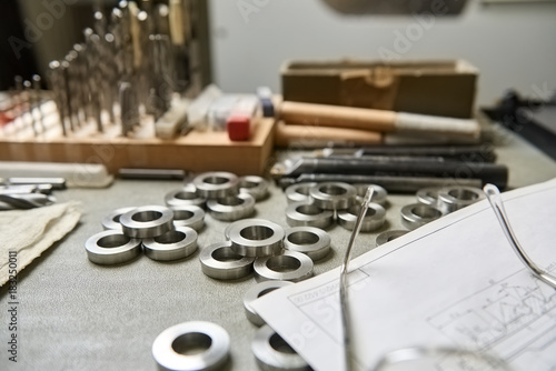 Steel washers on the table. Neatly arranged steel washers.