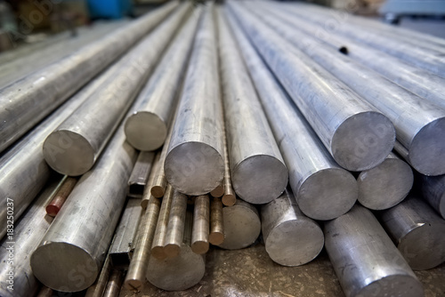 Pile of metal rods. Stainless steel bars.