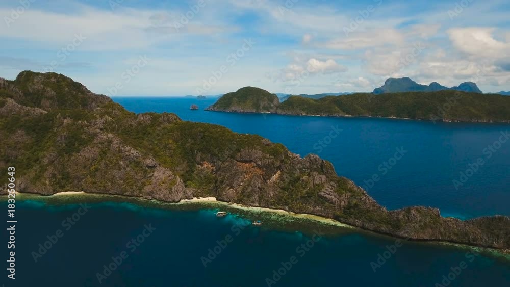 Tropical islands, aerial view. Aerial view: sea and the tropical island. Tropical bay in El Nido. Archipelago El Nido.Sandy beaches of the wild islands. Philippines National Marine Park. Aerial video Tropical islands, aerial view. Aerial view: sea and the tropical island. Tropical bay in El Nido. Archipelago El Nido.Sandy beaches of the wild islands. Philippines National Marine Park. Aerial video