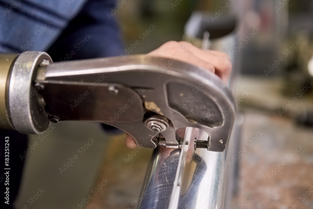 Rivet squeezer in action. Hand rivet squeezer close-up. Rivet squeezer in action. Hand rivet squeezer close-up.