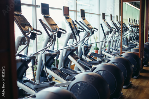 elliptical cross trainer in a row in a gym photo